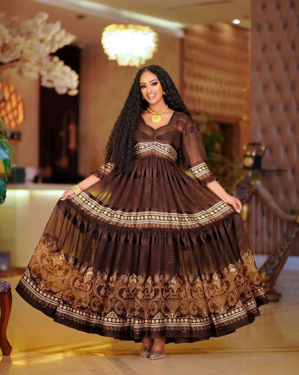 A sophisticated dark brown Habesha chiffon dress with a modern design, perfect for cultural and religious celebrations.