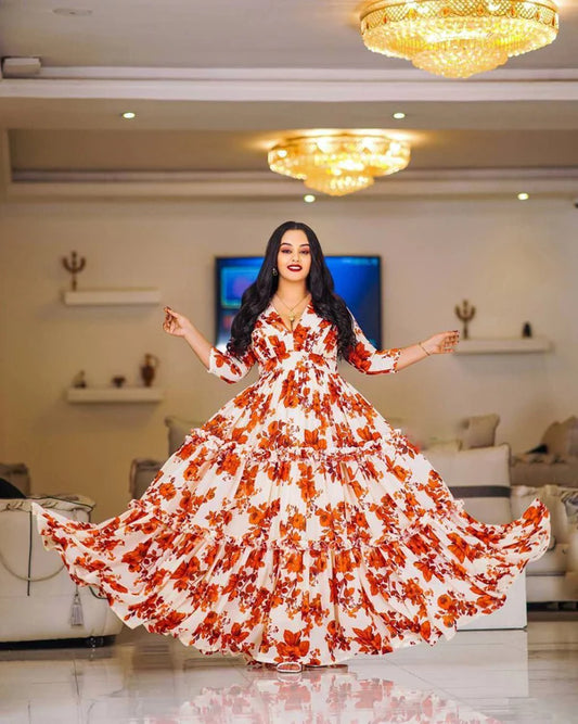 A lovely floral Habesha chiffon dress with red accents