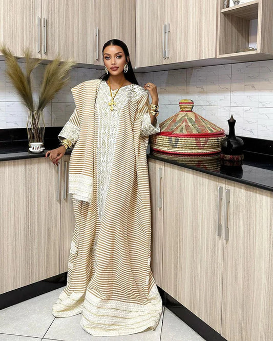 A delicately beautiful light beige Habesha Kemis