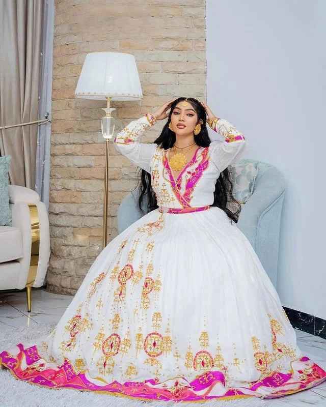 Enchanting Habesha wedding dress radiates beauty and elegance with its captivating pink hue