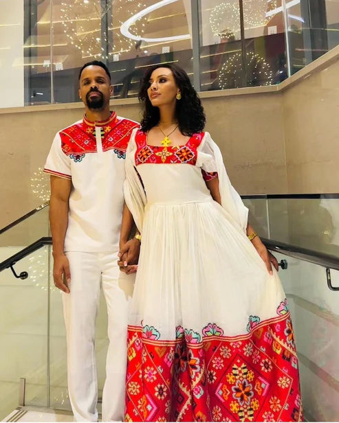 Passionate Red Bliss: Vibrant Habesha Couples Outfit in Menen Fabric.