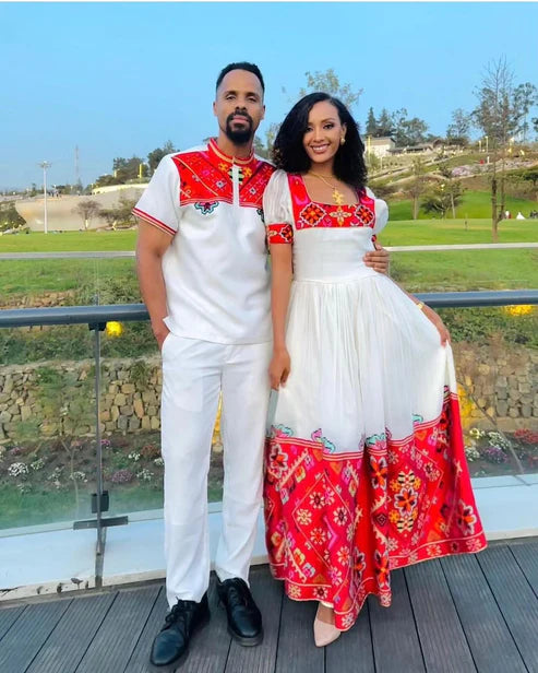 Passionate Red Bliss: Vibrant Habesha Couples Outfit in Menen Fabric.