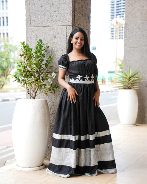 Harmonious Love in Black Matching Habesha Couples Outfit Featuring Silver Handcrafted Embroidery