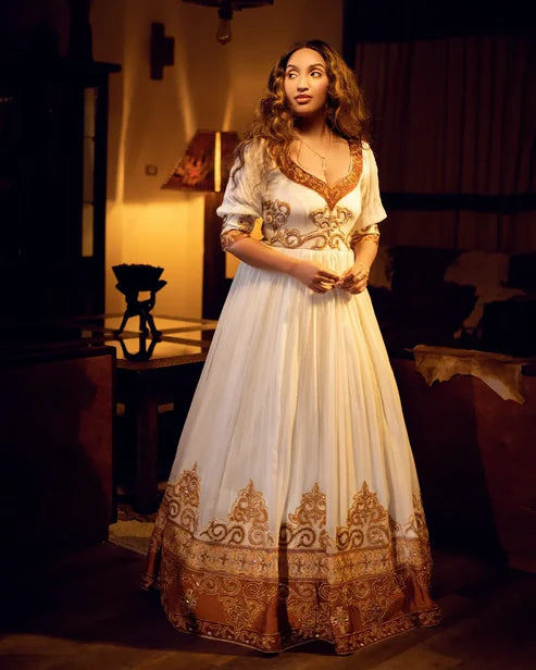 Marvelous Artistry on Golden Habesha Dress Glimmering Ornaments