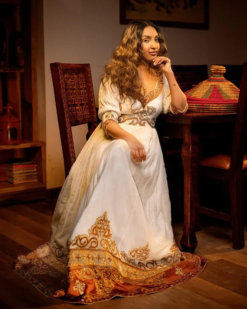Marvelous Artistry on Golden Habesha Dress Glimmering Ornaments