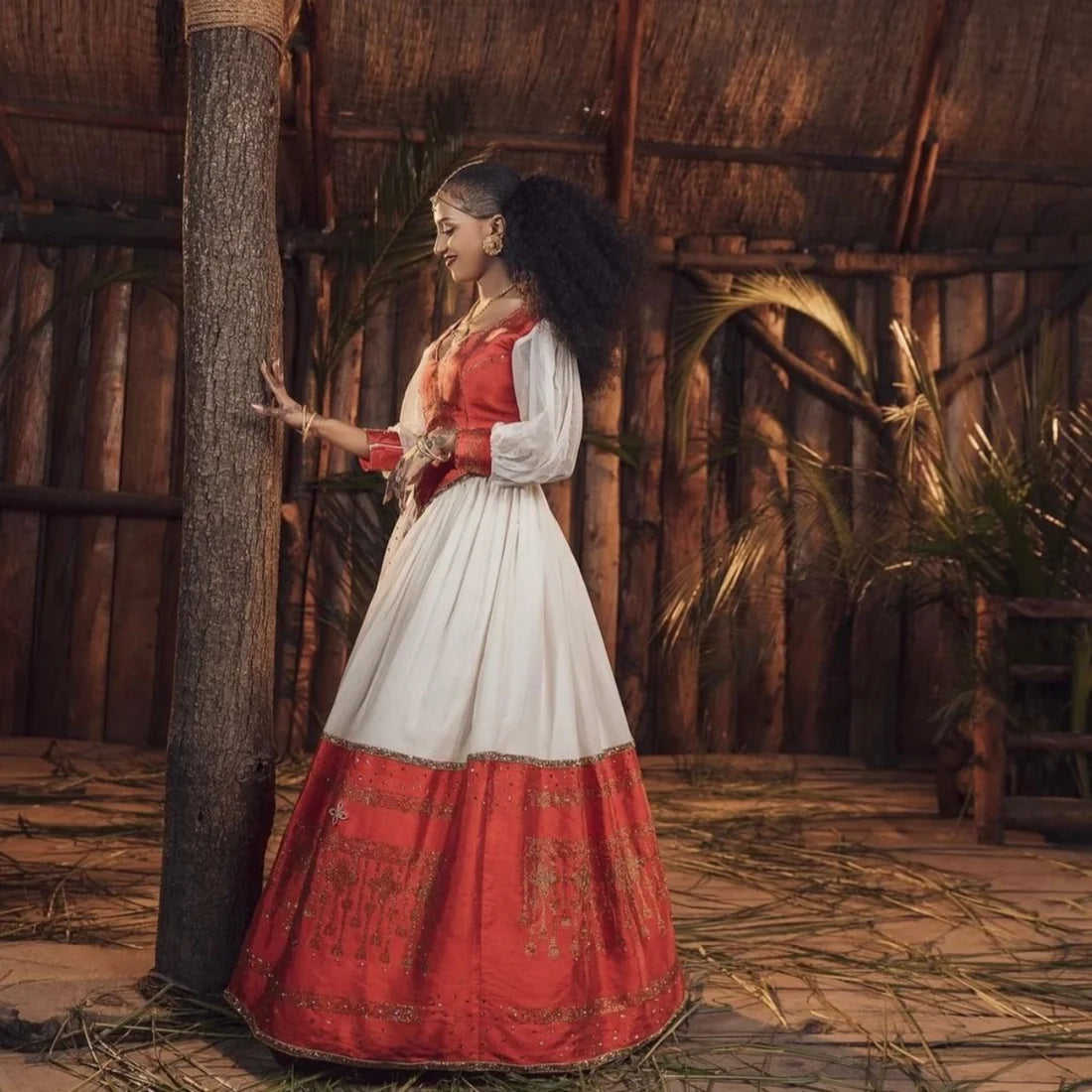 Magnificent Red Habesha Dress: Featuring a Corset Design and Gold Detailing
