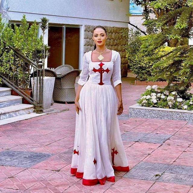 Regal red Habesha dress design featuring a striking red Tilf, embodying the elegance of Habesha fashion