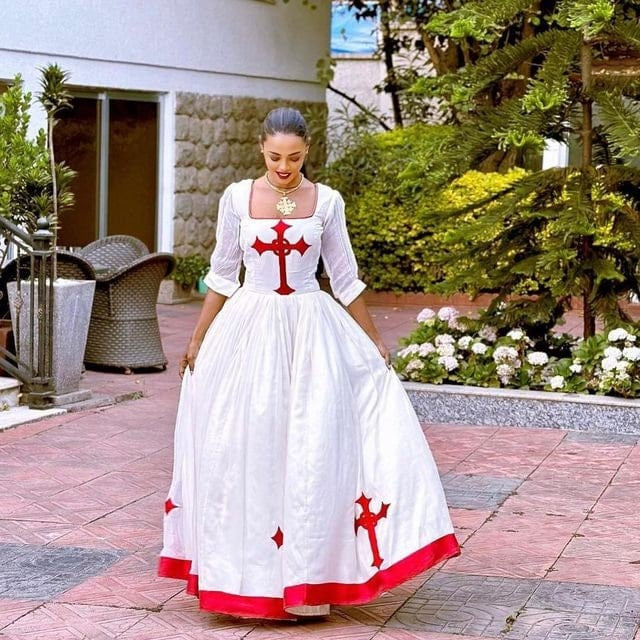 Regal red Habesha dress design featuring a striking red Tilf, embodying the elegance of Habesha fashion