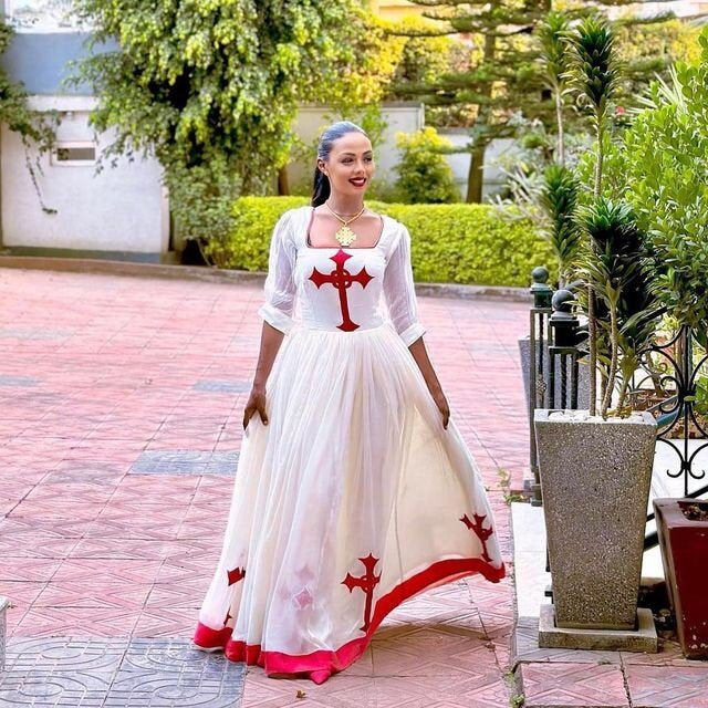 Regal red Habesha dress design featuring a striking red Tilf, embodying the elegance of Habesha fashion