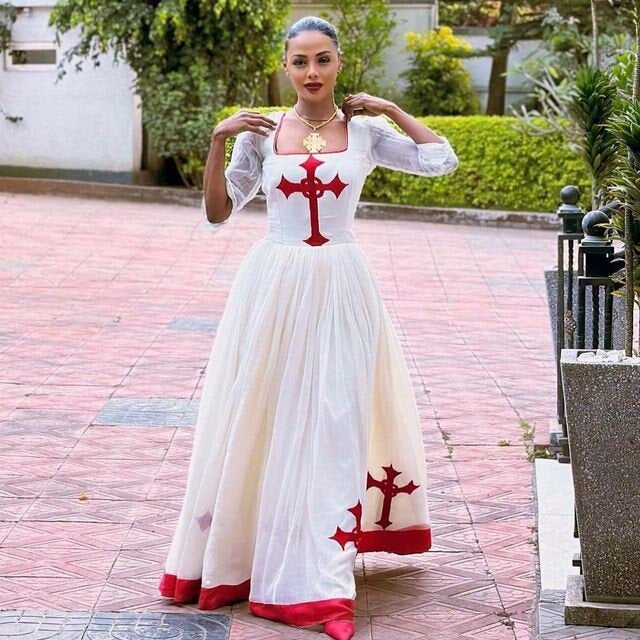 Regal red Habesha dress design featuring a striking red Tilf, embodying the elegance of Habesha fashion