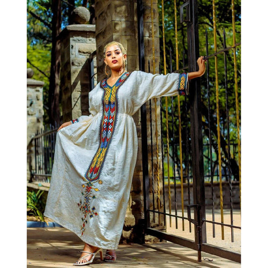 A stunning Fetil Habesha Kemis featuring intricate Tilf patterns and a beautiful Habesha libs design