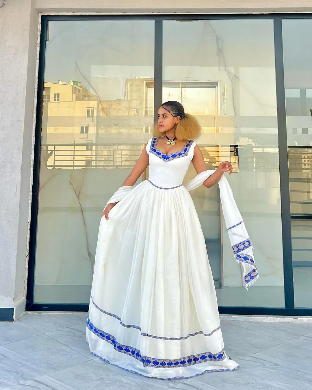 Exude Sophistication in Our Stylish Habesha Gown Beautiful Azure Habesha Ensemble
