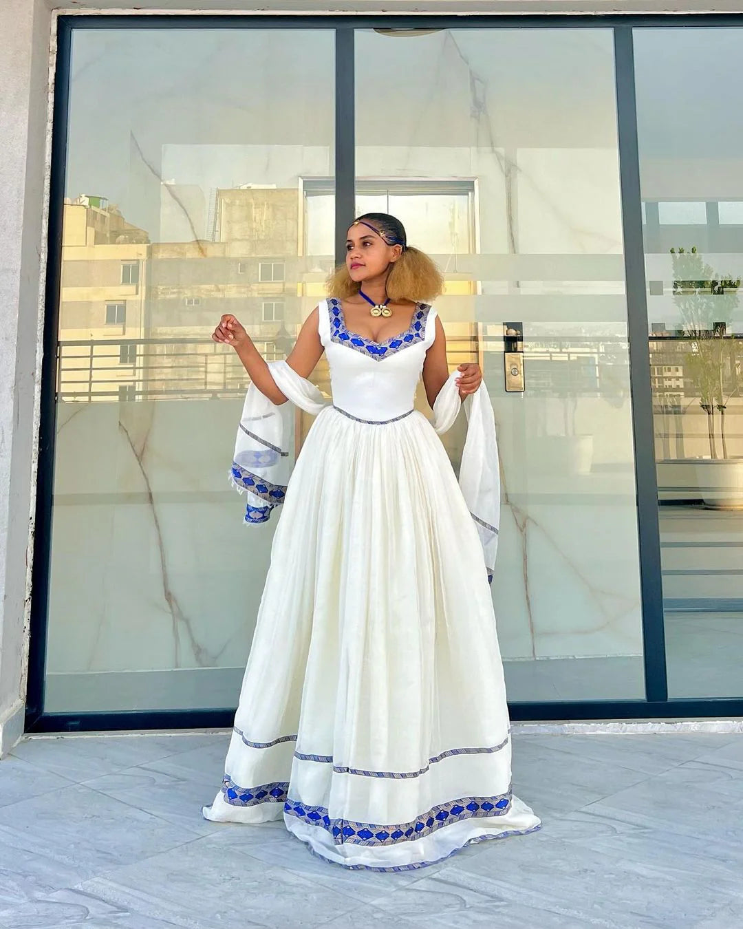 Exude Sophistication in Our Stylish Habesha Gown Beautiful Azure Habesha Ensemble