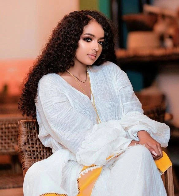 Sunshine in Menen Textile A Gleaming Golden Habesha Dress