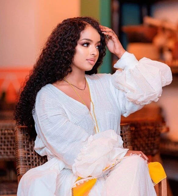 Sunshine in Menen Textile A Gleaming Golden Habesha Dress