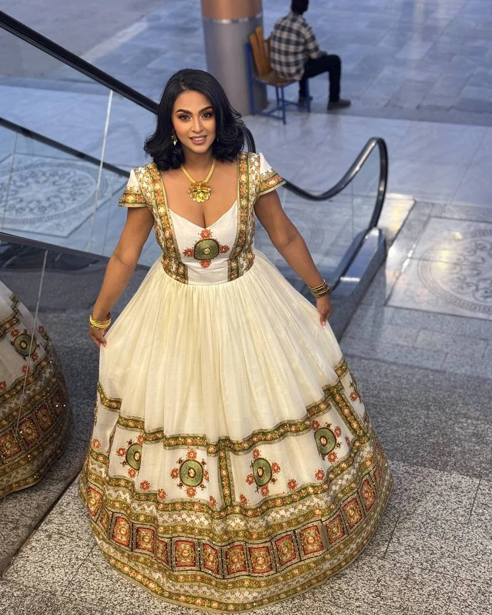 Harmonious Elegance A Traditional Habesha Couple's Ensemble