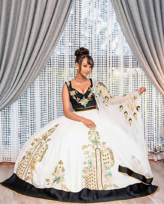 Beautiful Habesha Dress with Intricate Embroidery and Sheer Overlay