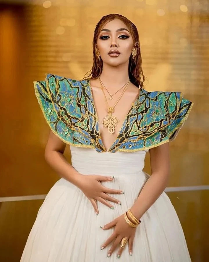 Beautiful Habesha Dress with Intricate Blue and Gold Embroidery