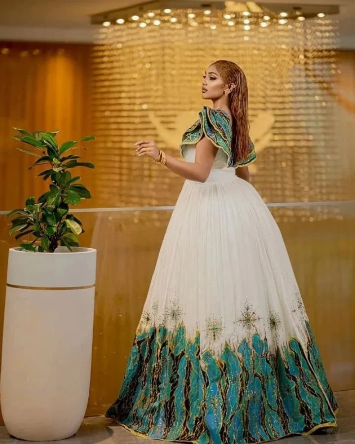 Beautiful Habesha Dress with Intricate Blue and Gold Embroidery