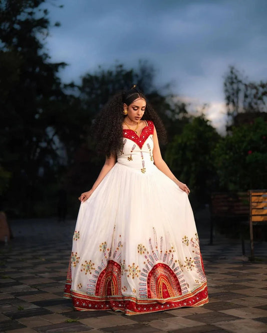 Elegant Habesha Dress with Intricate Embroidery and Vibrant Colors