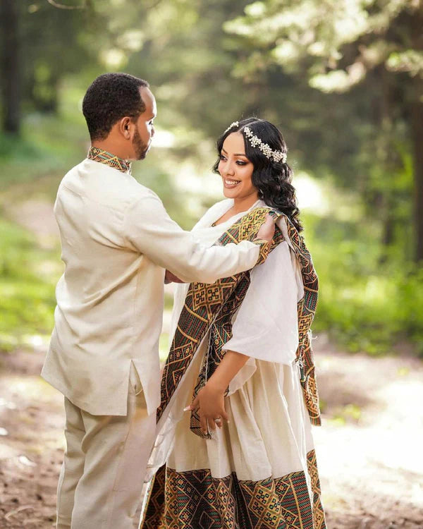 Artistry Unveiled: Handwoven Elegance in Habesha Couples' Outfit.
