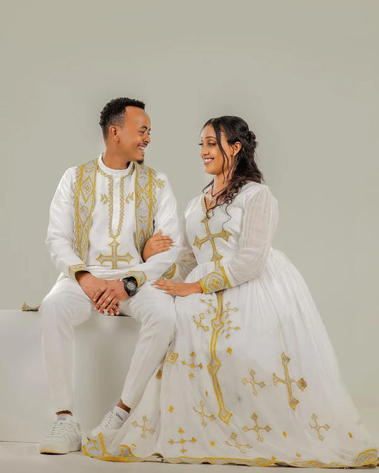 Golden Cross Design: Habesha Couples Outfit for Weddings and Special Occasions.