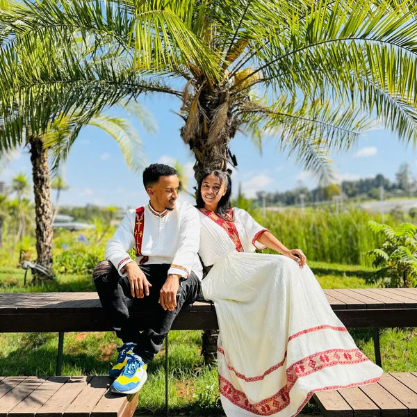 Timeless Unity: Simple Red Menen Habesha Couples' Ensemble.