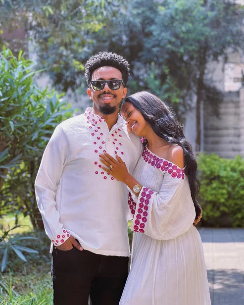Contemporary Harmony: Beautiful Habesha Couples Outfit with Vibrant Circle Designs.