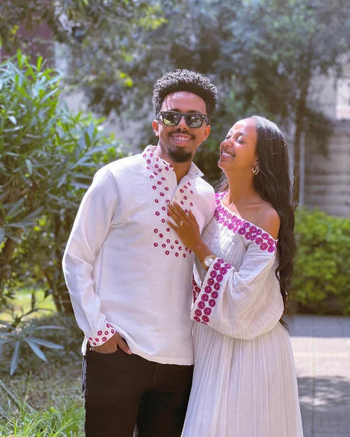 Contemporary Harmony: Beautiful Habesha Couples Outfit with Vibrant Circle Designs.