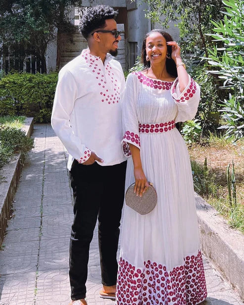 Contemporary Harmony: Beautiful Habesha Couples Outfit with Vibrant Circle Designs.
