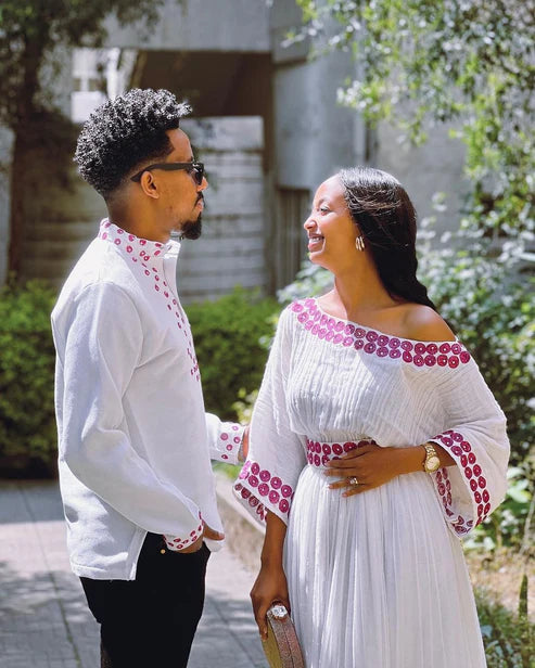 Contemporary Harmony: Beautiful Habesha Couples Outfit with Vibrant Circle Designs.