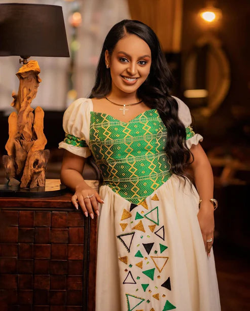 Contemporary Elegance: Habesha Wedding Attire with Modern Green Designs.