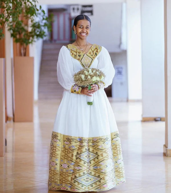 Contemporary Splendor: Modern Elegance in Habesha Couples Wedding Attire.