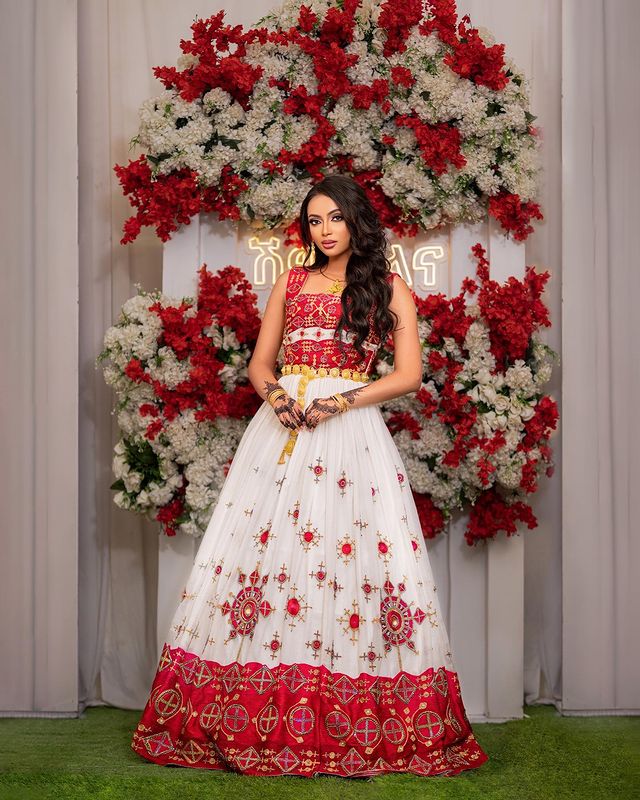 Captivating Habesha wedding dress radiates elegance and beauty with its vibrant red design
