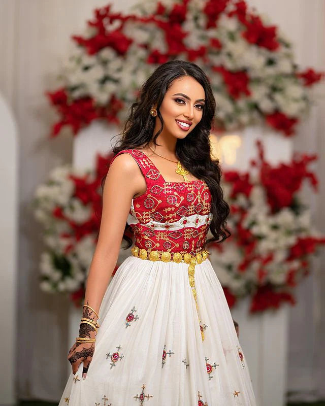 Captivating Habesha wedding dress radiates elegance and beauty with its vibrant red design