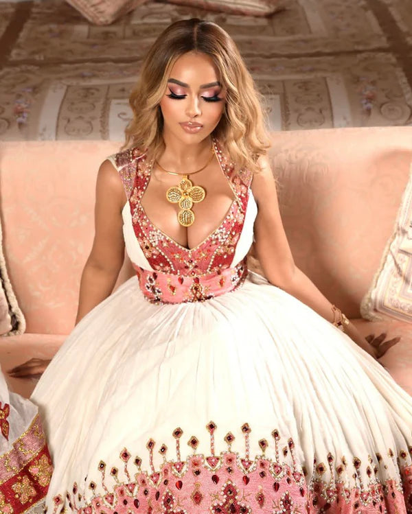 Elegant Pink and Multicolored Habesha Wedding Dress: Cross Adornments, Beautiful Habesha Style