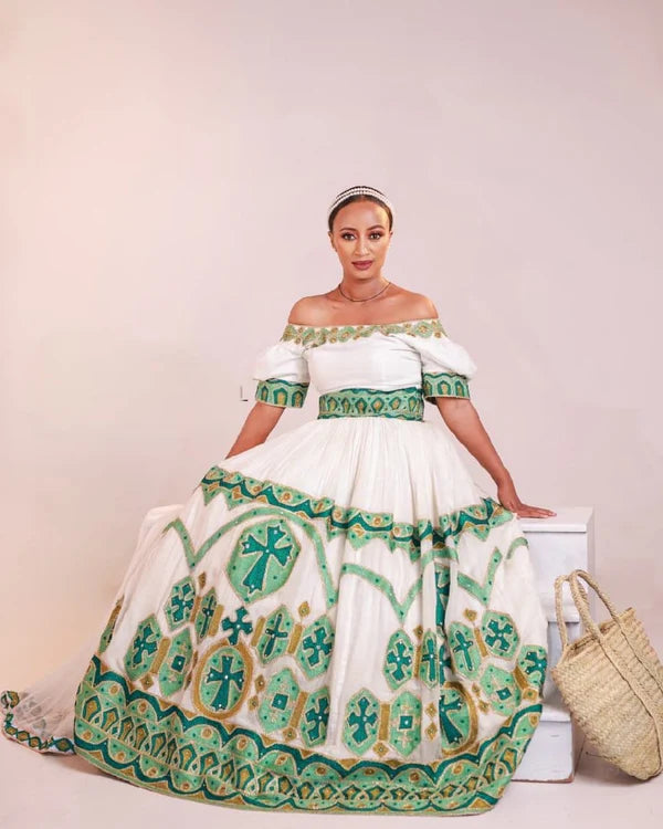 Stylish Green Habesha Wedding Dress: A Modern Off-Shoulder Habesha Design.