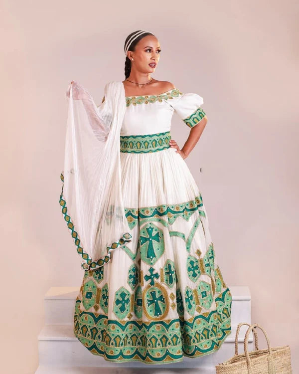 Stylish Green Habesha Wedding Dress: A Modern Off-Shoulder Habesha Design.