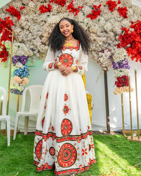 Beautiful Red Habesha Wedding Dress: Adorned with wide, dazzling embellishments