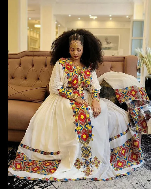 Eye-Catching Habesha Kemis: Multicolored Habesha Dress with a Colorful Hemline