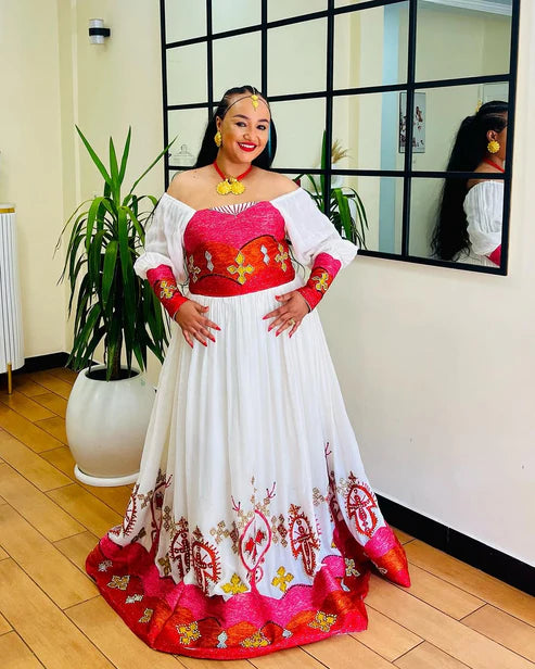 Classic Off-Shouldered Pink and Red Habesha Dress: Golden Cross Embellishments.